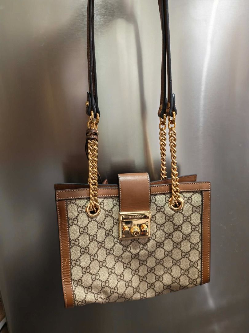 Gucci Monogram Canvas Leather Chain Shoulder Bag (Category: Luxury Bags & Wallets) located in Davao. Submitted by shophacks7 (Listing ID 1462452408, Image 1). Description: - Gucci medium bag - Classic GG monogram canvas - Brown leather trim - Gold chain strap and hardware .