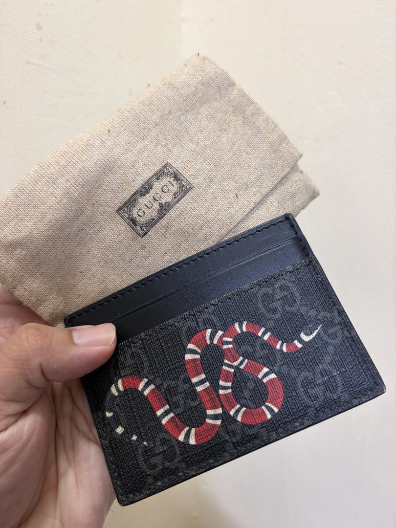 Gucci Snake Card Holder (Category: Luxury Bags & Wallets) located in Quezon City. Submitted by Lyavable.shop (Listing ID 1462482195, Image 3). Description: - Authentic Gucci card holder - Features iconic GG pattern and snake design - Multiple card slots for easy organization - Compact and stylish accessory - Perfect for keeping your essentials neat -Bought in Gucci, Shinkong Ximen Tainan, Taiwan.