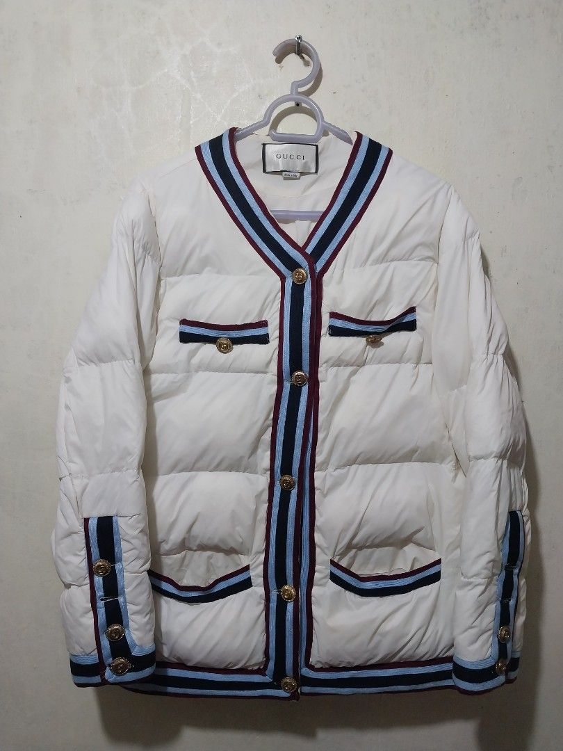 Gucci White Down Jacket with Navy and Red Trim (Category: Coats, Jackets and Outerwear) located in Manila. Submitted by PrinceDani.Clothing (Listing ID 1462490276, Image 1). Description: gucci white puffer jacket Medium 20in width 25in length issue: missing buttons hem sleeves excellent condition .