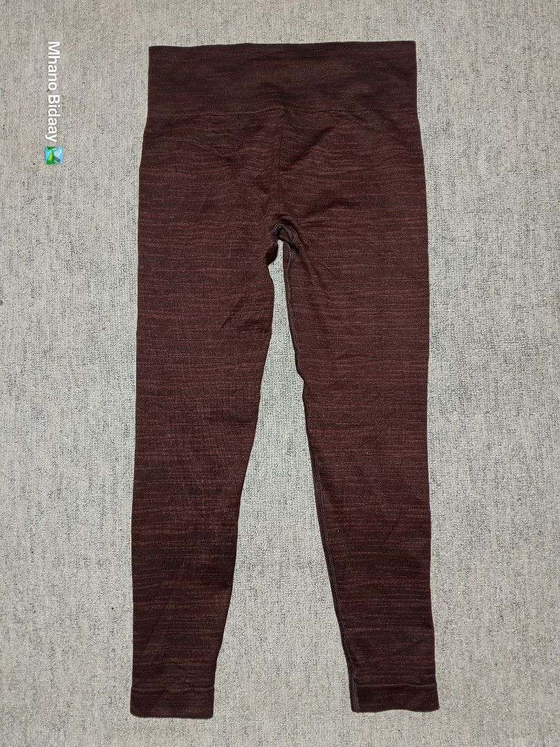 Gymshark Adapt Marl Seamless Leggings Medium (Category: Activewear) located in Valencia. Submitted by mhano_bidaay_outdoors_218 (Listing ID 1462516165, Image 3). Description: - Gymshark Adapt Marl Seamless Leggings - Size: Medium - Waistline: 28-30 inches - Length: 31 inches - Color: Marled brown/red - Fabric: Quick-drying - Condition: Very good, with one small crack on the print - Perfect for workouts!.