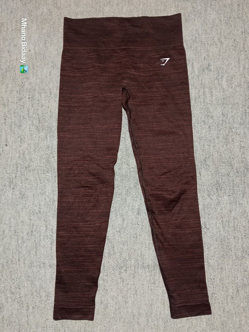 Gymshark Adapt Marl Seamless Leggings Medium (Category: Activewear) located in Valencia. Submitted by mhano_bidaay_outdoors_218 (Listing ID 1462516165, Image 2). Description: - Gymshark Adapt Marl Seamless Leggings - Size: Medium - Waistline: 28-30 inches - Length: 31 inches - Color: Marled brown/red - Fabric: Quick-drying - Condition: Very good, with one small crack on the print - Perfect for workouts!.