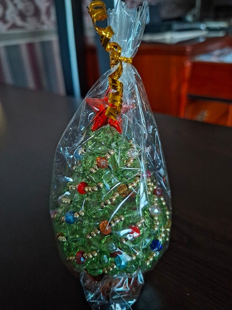 Handmade beaded christmas tree (Category: Other Home Decor) located in Pasig City. Submitted by keekeedee (Listing ID 1462557896, Image 2). Description: price each handmade brand new sealed pwede pang gift the size reference is shown sa pics and the bead may vary teknikolor sya size ng kabute so cute pan display sa mesa.
