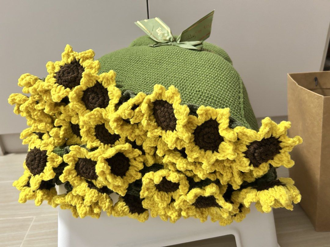 Handmade Knitted Sunflower Blanket Throw (Category: Bedding & Towels) located in Navotas City. Submitted by rivera_ysalouis (Listing ID 1462453489, Image 2). Description: - Adorable handmade knitted blanket - Vibrant green with cheerful yellow sunflowers around the edge - Super cozy and soft texture - Perfect for adding a pop of color and warmth to your couch or bed - Ideal for snuggling up on chilly days.