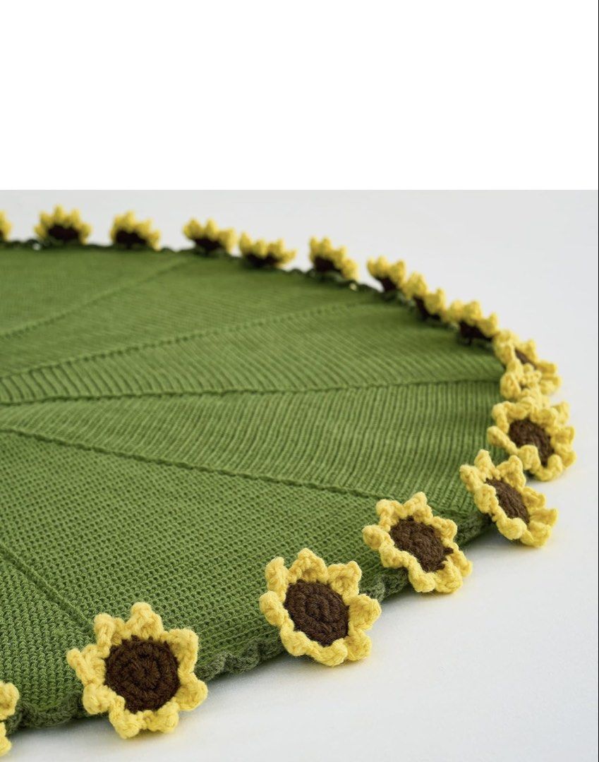 Handmade Knitted Sunflower Blanket Throw (Category: Bedding & Towels) located in Navotas City. Submitted by rivera_ysalouis (Listing ID 1462453489, Image 3). Description: - Adorable handmade knitted blanket - Vibrant green with cheerful yellow sunflowers around the edge - Super cozy and soft texture - Perfect for adding a pop of color and warmth to your couch or bed - Ideal for snuggling up on chilly days.