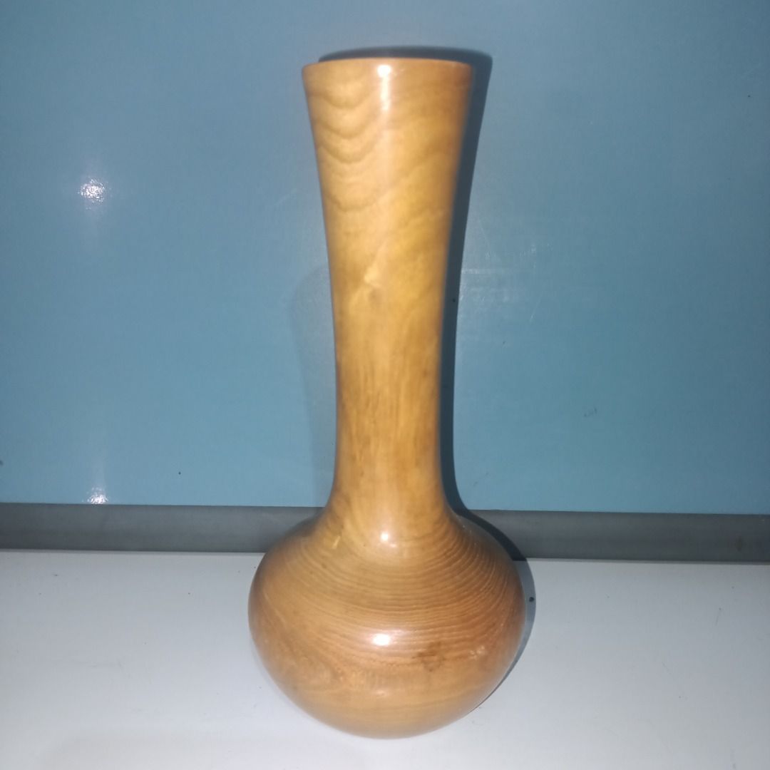 Handmade Wooden Vase with Maker's Mark (Category: Vases & Decorative Bowls) located in Munoz. Submitted by larryc1212 (Listing ID 1462489762, Image 1). Description: - Small, handcrafted wooden vase - Features beautiful, natural wood grain - Maker's mark stamped on the bottom - Perfect for displaying a single stem - Also great as a standalone decorative piece - Approximately 6.25 inches tall - Truly unique item Disclaimer: Item may include some sc