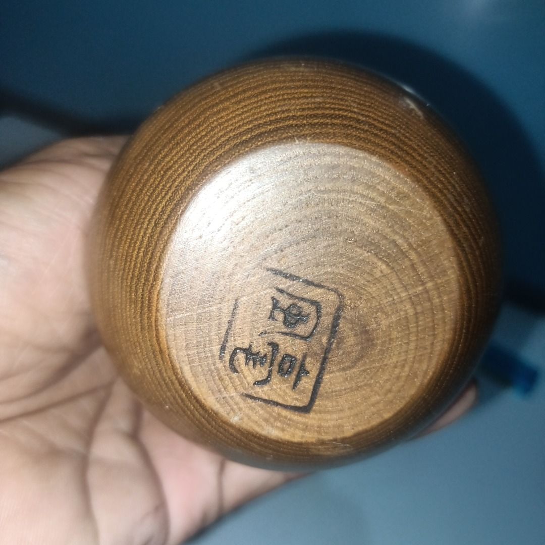 Handmade Wooden Vase with Maker's Mark (Category: Vases & Decorative Bowls) located in Munoz. Submitted by larryc1212 (Listing ID 1462489762, Image 3). Description: - Small, handcrafted wooden vase - Features beautiful, natural wood grain - Maker's mark stamped on the bottom - Perfect for displaying a single stem - Also great as a standalone decorative piece - Approximately 6.25 inches tall - Truly unique item Disclaimer: Item may include some sc
