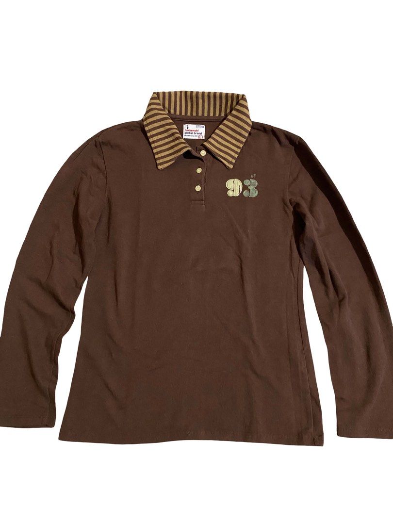 Herbench Brown Long Sleeve Polo Top (Category: Shirts) located in Manila. Submitted by thrift.bell (Listing ID 1462645412, Image 1). Description: Tag Size: Large (L) — Best fits Small to Medium Length: 23 Width: 16.5 Sleeve Length: 22 Color: Brown & Tan Flaws: None Condition: 10 / 10 .
