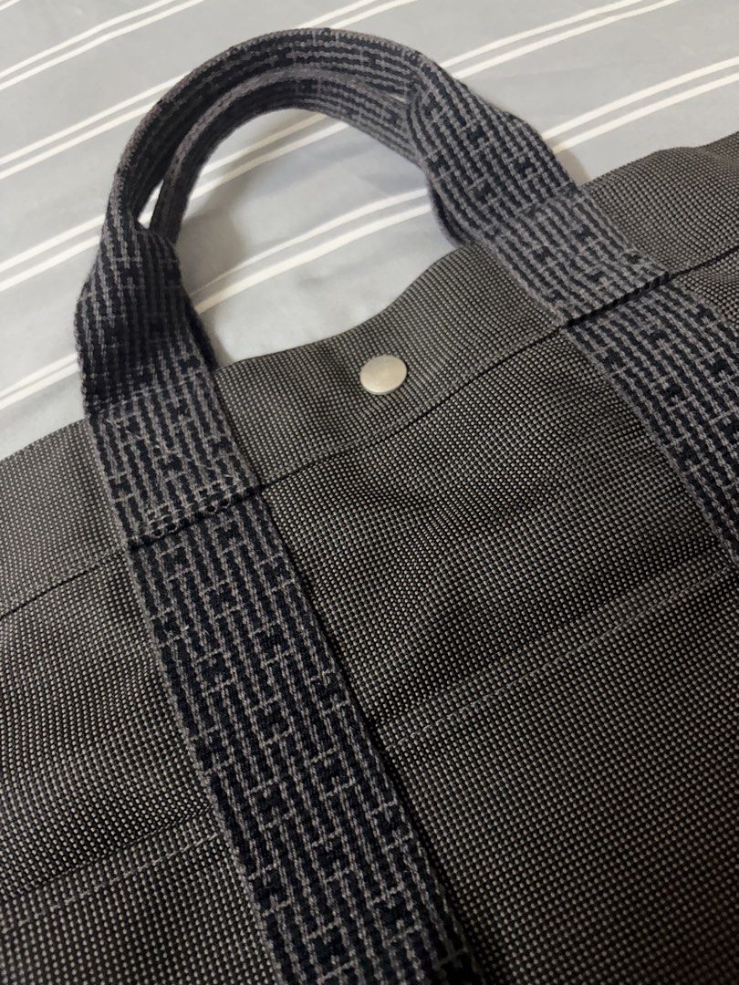 Hermes Herbag Tote Bag Grey Canvas (Category: Luxury Bags & Wallets) located in Quezon City. Submitted by anna12annaf (Listing ID 1462552598, Image 1). Description: - Grey canvas tote bag - Features patterned straps - Secure snap closure - Spacious and practical for everyday use - Durable material - Classic design Fourre Tout Cabas tote.