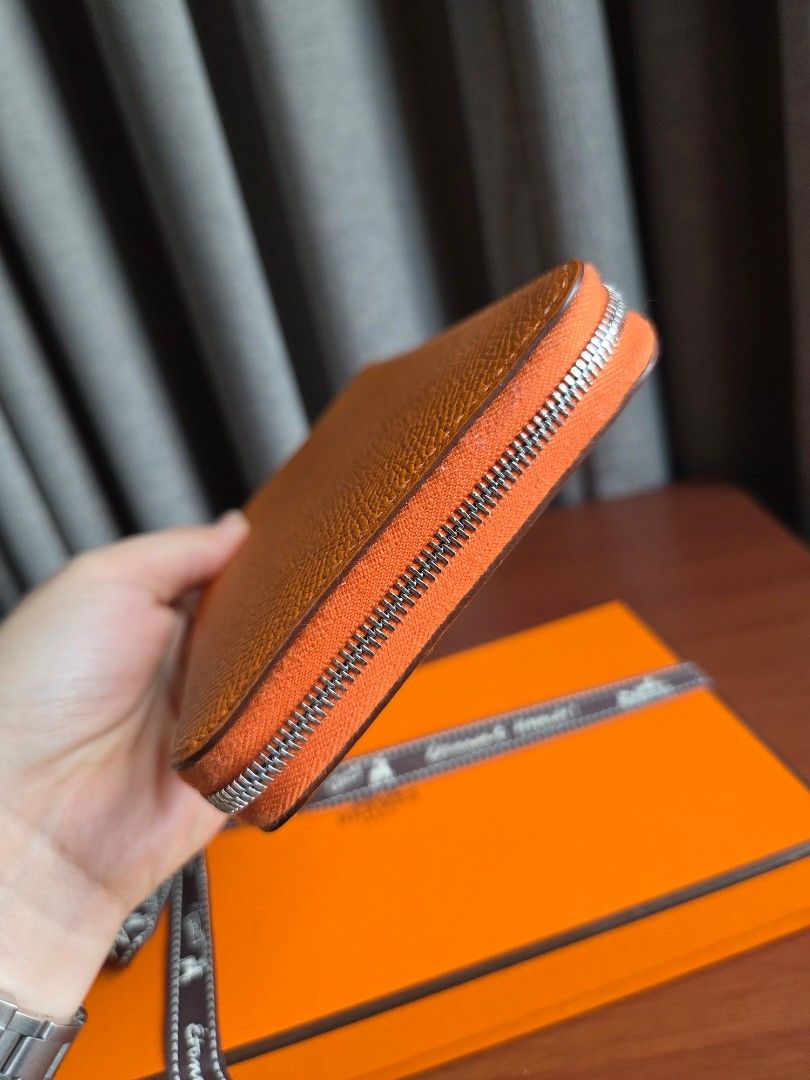 Hermes Silk-in Long wallet Orange (Category: Luxury Bags & Wallets) located in Quezon City. Submitted by shop.mar.go (Listing ID 1462477276, Image 3). Description: hermes silk-in long wallet orange palladium hardware stamp B comes with box used twice only..