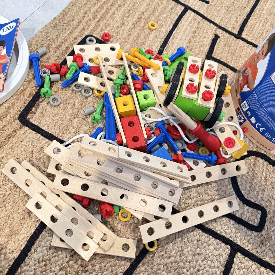 HEROS Germany Constructor Building Toy Set (Category: Educational & Learning Toys) located in Manila. Submitted by pinklilo (Listing ID 1462486358, Image 2). Description: Wooden construction toy set from HEROS Germany. Lots of pieces for building and creating. Includes wooden planks, screws, nuts, and colorful plastic connectors. Great for imaginative play and developing fine motor skills. Comes in a blue storage bucket..