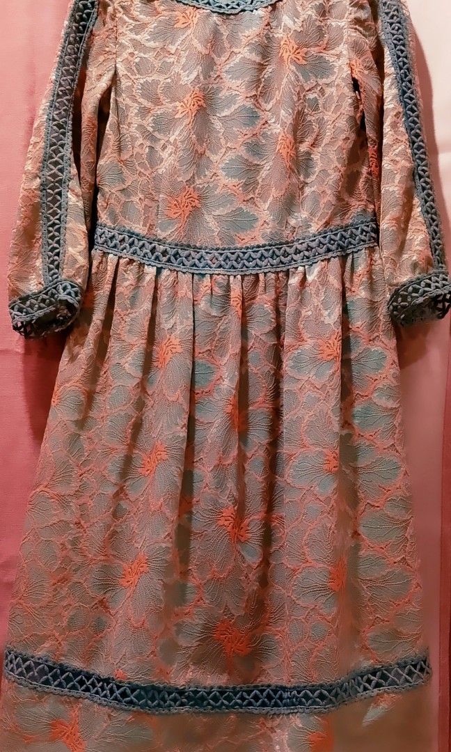 Hitorat lace midi dress (Category: Dresses) located in Cabanatuan. Submitted by miss.maia (Listing ID 1462653066, Image 2). Description: The selected item is a Hitorat lace midi dress featuring a distinctive contrast design. Key Features Fabric & Pattern: Made of a multi-toned floral overlay lace featuring a soft peach/salmon pattern over a muted sage green or gray lining. Trim Details: Enhanced with geometric crochet open-weave lattice trimmings