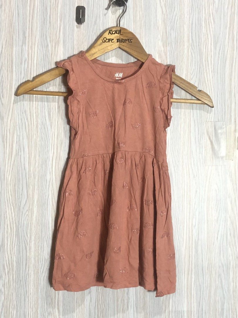 H&M Basic Kids Cotton Dress 2-3 Years Old (Category: Babies & Kids Fashion) located in Montevista. Submitted by rdthriftshub (Listing ID 1462666197, Image 1). Description: - Brand: H&M - Color: Salmon pink with subtle textured pattern - Style: Flutter sleeves, gathered waist - Material: Basic cotton - Size: Fits 2-3 year old - Occasion: Everyday wear or special occasions - Condition: Great for your little one.
