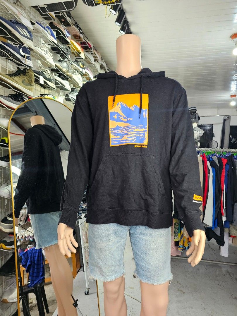 H&M black pullover hoodie (Category: Coats, Jackets and Outerwear) located in Baguio. Submitted by kayeonlineshop (Listing ID 1462463740, Image 1). Description: -H&M black pullover hoodie featuring a vibrant orange and blue mountain graphic with "grand lake" lettering on the front.