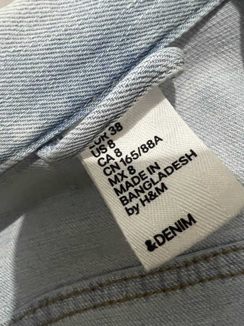 H&M Light Wash Denim Jacket (Category: Coats, Jackets and Outerwear) located in Carmona. Submitted by mystyleph (Listing ID 1462564048, Image 3). Description: - H&M light wash denim jacket - Classic trucker style - Button closure - Chest pockets - Features distressed details - Ideal for layering - Versatile for any outfit.