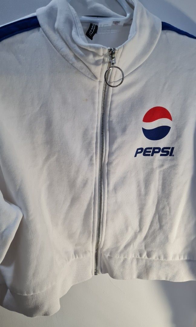 H&M MTV & Pepsi Cropped Zip-Up Jackets (Category: Coats, Jackets and Outerwear) located in Cavite. Submitted by greysieg (Listing ID 1462659815, Image 3). Description: - Two cropped zip-up jackets, both size M. - Black jacket features MTV logo and 'Music Television' tape on sleeves. - White jacket features Pepsi logo and blue stripes. - Ideal for casual wear or a cool retro vibe. payment via GCash .