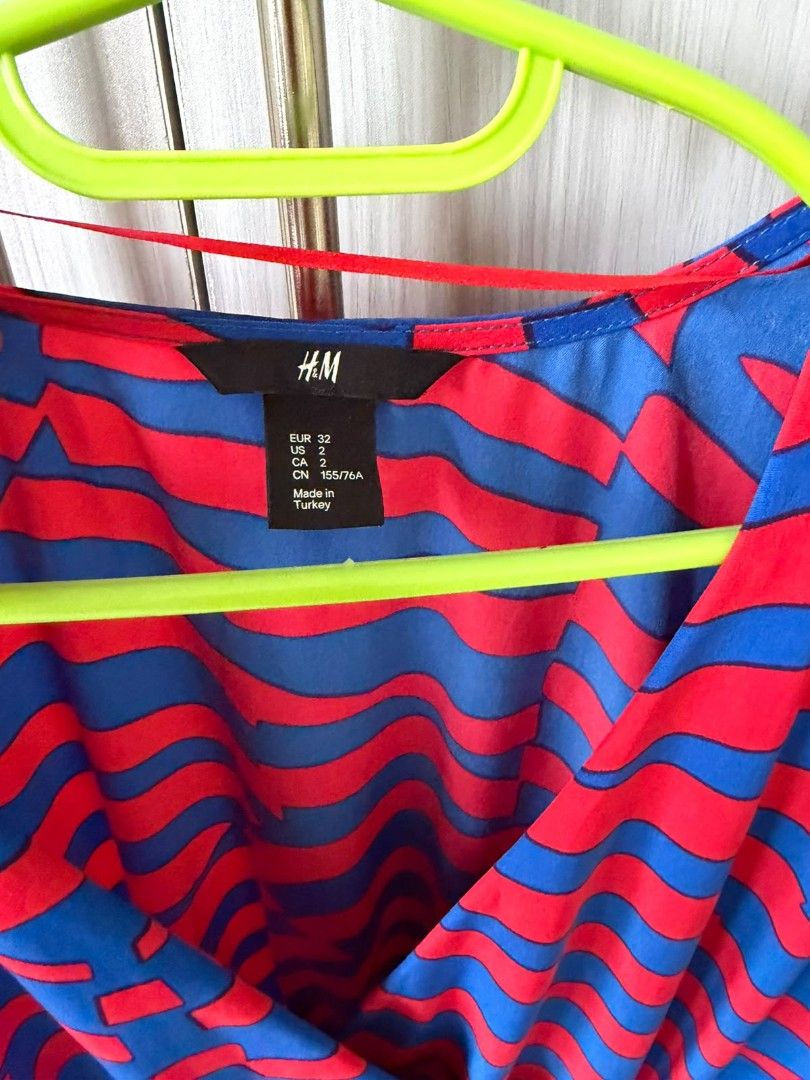 H&M Red Blue Striped Wrap Dress (Category: Dresses) located in Consolacion. Submitted by i.am.xs.or.s (Listing ID 1462536196, Image 2). Description: - Cute H&M wrap dress - Red and blue wavy stripe pattern - Elasticated waist with drawstring - Short, fluttery sleeves - Ideal for casual outings or beach days - Easy to wear and style.