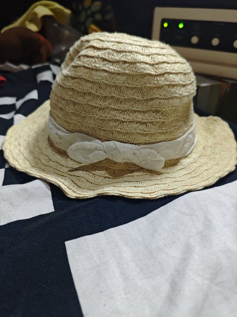 H&M Straw Hat for Baby/Toddler (Category: Babies & Kids Fashion) located in Pasig City. Submitted by love_happybee (Listing ID 1462497635, Image 2). Description: - Cute straw hat from H&M - Size 74cm (fits 6-9 months) - Adorable pink ribbon with a bow detail - Ideal for sunny days and summer outings - Provides sun protection for your little one.