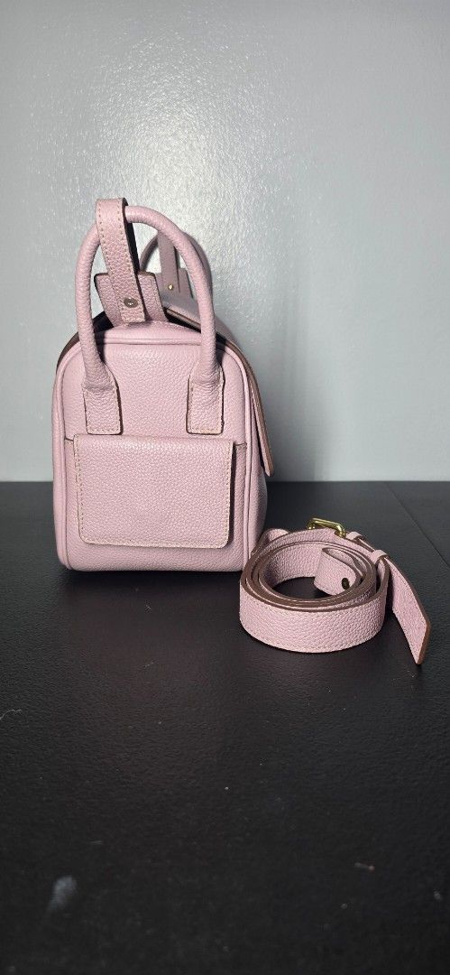 Holb genunine leather treasure (Category: Shoulder Bags) located in Manila. Submitted by chubbychic553 (Listing ID 1462642182, Image 2). Description: BRAND: HOUSE OF LITTLE BUNNY color: Taro Genuine Leather flaw: few discoloration (bluish) - Top handles and detachable shoulder strap - Gold hardware details - Four metal feet on the bottom ( few tarnishing) well taken cared with leather conditioner PHP 3500 location Tayuman Manila shipping via j&t,