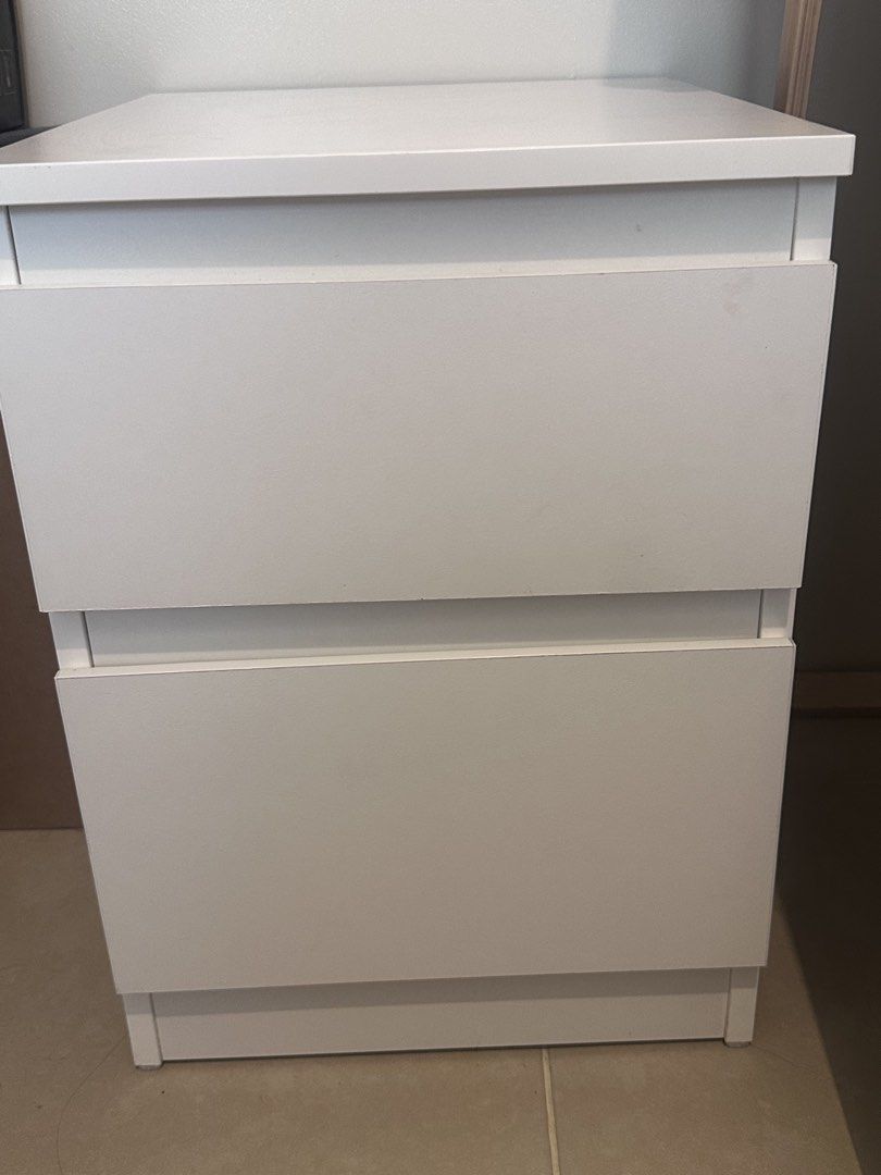 Ikea KULLEN White 2-Drawer Nightstand (Category: Shelves, Cabinets & Racks) located in Taguig. Submitted by beatrizangela (Listing ID 1462492820, Image 1). Description: - White two-drawer unit - Versatile: Use as a filing cabinet or nightstand - Minor scuffs / stains on the top surface (3rd photo) pickup location: BGC TAGUIG .
