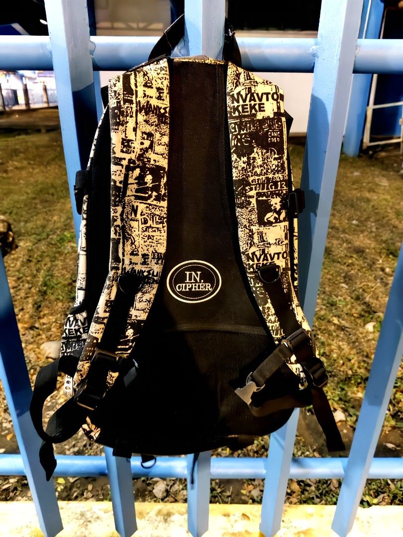 IN CIPHER Graphic Print Backpack (Category: Backpacks) located in Manila. Submitted by joshespino71762 (Listing ID 1462607002, Image 3). Description: - Stylish black and cream graphic print backpack - Convenient mesh front pocket - Adjustable padded straps for maximum comfort - Includes a sturdy top handle - Ideal for everyday adventures or your next trip.