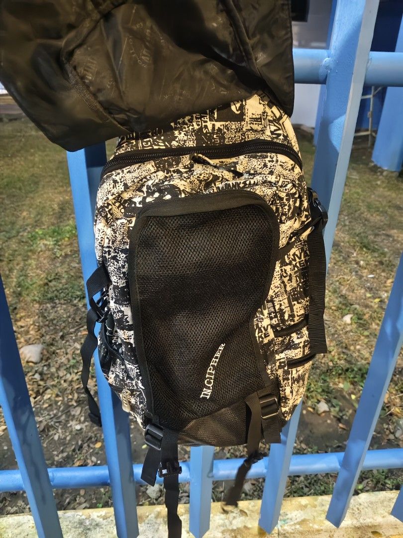 IN CIPHER Graphic Print Backpack (Category: Backpacks) located in Manila. Submitted by joshespino71762 (Listing ID 1462607002, Image 2). Description: - Stylish black and cream graphic print backpack - Convenient mesh front pocket - Adjustable padded straps for maximum comfort - Includes a sturdy top handle - Ideal for everyday adventures or your next trip.