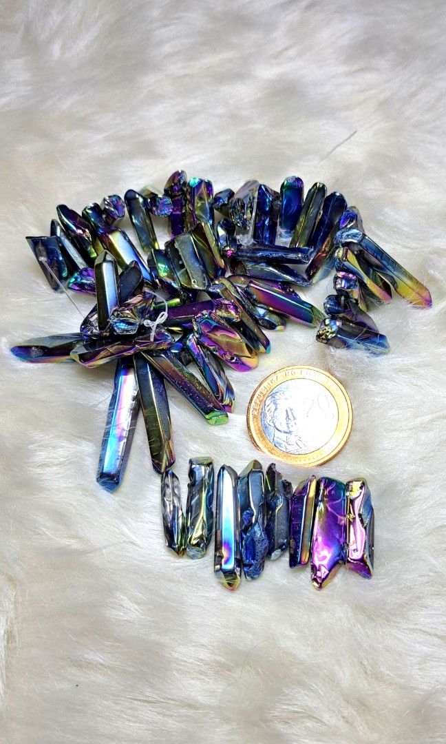 Iridescent Aura Quartz Crystal Points for Decor (Category: Precious Stones) located in Quezon City. Submitted by crystallinehaven (Listing ID 1462662879, Image 1). Description: - Stunning iridescent aura quartz crystal points - Features a beautiful rainbow sheen with blue, purple, and gold hues - Ideal for crystal grids, home decor, or energy work - Each piece is unique and will be a random selection from the batch - Coin included in photo for si