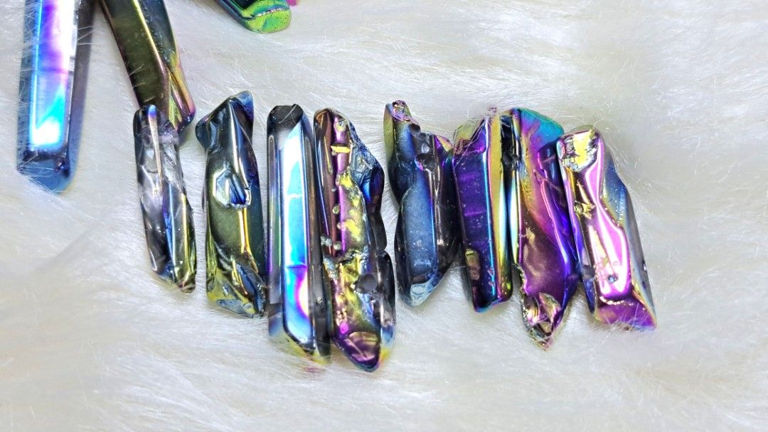 Iridescent Aura Quartz Crystal Points for Decor (Category: Precious Stones) located in Quezon City. Submitted by crystallinehaven (Listing ID 1462662879, Image 3). Description: - Stunning iridescent aura quartz crystal points - Features a beautiful rainbow sheen with blue, purple, and gold hues - Ideal for crystal grids, home decor, or energy work - Each piece is unique and will be a random selection from the batch - Coin included in photo for si