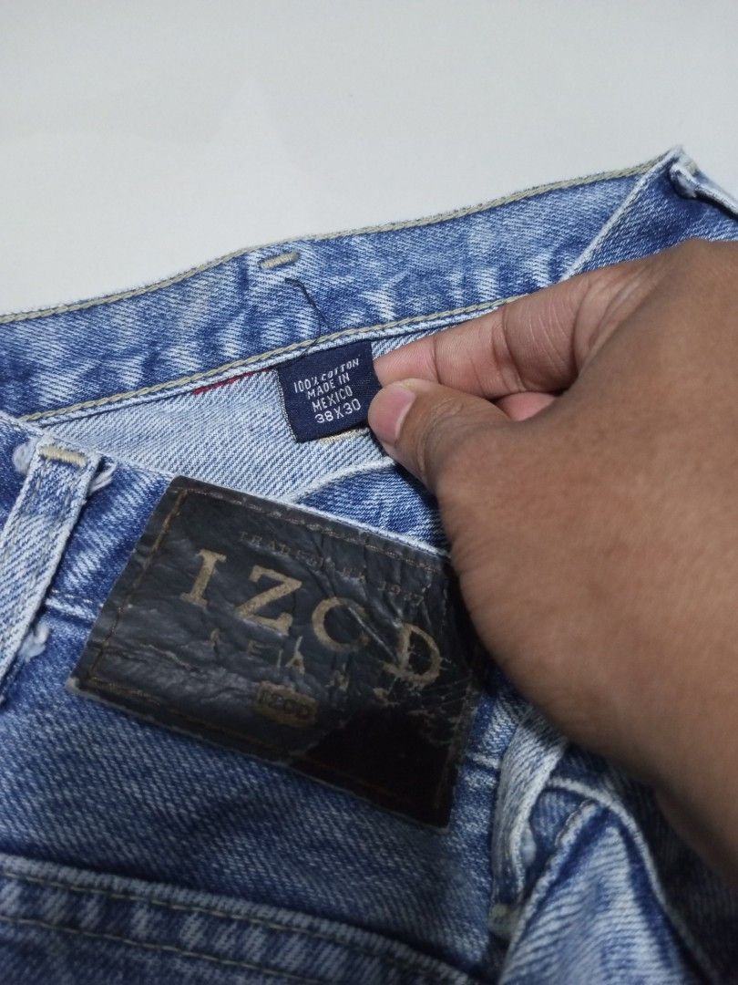 Izod Denim Wash Pants 38x30 (Category: Jeans) located in Magdalena. Submitted by magdalenathrift20 (Listing ID 1462566563, Image 3). Description: - Izod Denim Wash Pants - Size: 38x30 (Waist fits 38-40 inches) - Length: 41 inches - Material: 100% Cotton - Origin: Made in Mexico - Condition: Has a dark stain on the left leg. Please check photos for details..