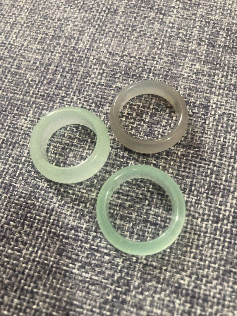 Jade and Agate Rings Set (Category: Rings) located in Valenzuela. Submitted by theaveqc04360 (Listing ID 1462605805, Image 1). Description: - Bangle band rings: 2 light green jade, 1 translucent grey agate and white jade - Also includes a set of darker rings, possibly obsidian. - Some rings come with their original certification cards. - Selling per piece.