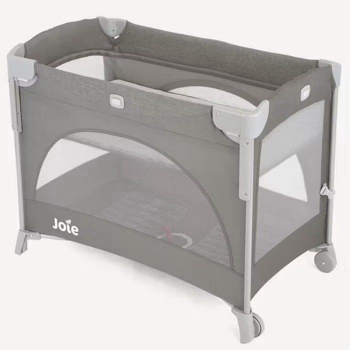 Joie Crib with Carry Bag (Category: Cots & Cribs) located in Taguig. Submitted by laramagbalana (Listing ID 1462664548, Image 3). Description: - Joie travel cot in stylish grey. - Comes with a convenient carry bag for easy transport. - Features mesh sides for optimal ventilation. - Folds down compactly for storage and travel. - Equipped with wheels on one side for effortless moving. - Ideal for trips or as a handy spare cot. - Newly deep cleaned 