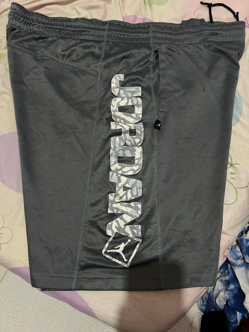 Jordan Grey Athletic Shorts (Category: Shorts) located in Manila. Submitted by mightyturtle_e6e74b (Listing ID 1462623578, Image 1). Description: - Grey Jordan athletic shorts - Breathable mesh material - Elastic waistband with drawstring - Iconic Jordan logo on front - Large Jordan graphic down the side - Perfect for sports or everyday casual wear.