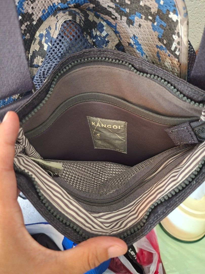 Kangol IT Slim Bag Grey Sling Bag (Category: Sling Bags) located in Marikina City. Submitted by Bilimokononatnyan (Listing ID 1462450375, Image 2). Description: - Grey Kangol sling bag - Ideal for everyday use - Main zippered compartment - Inner pocket for organization - Adjustable strap with a stylish leather accent - Unique mesh detail on one inside pocket - Model number: KFB-CB30151 - plus sf.