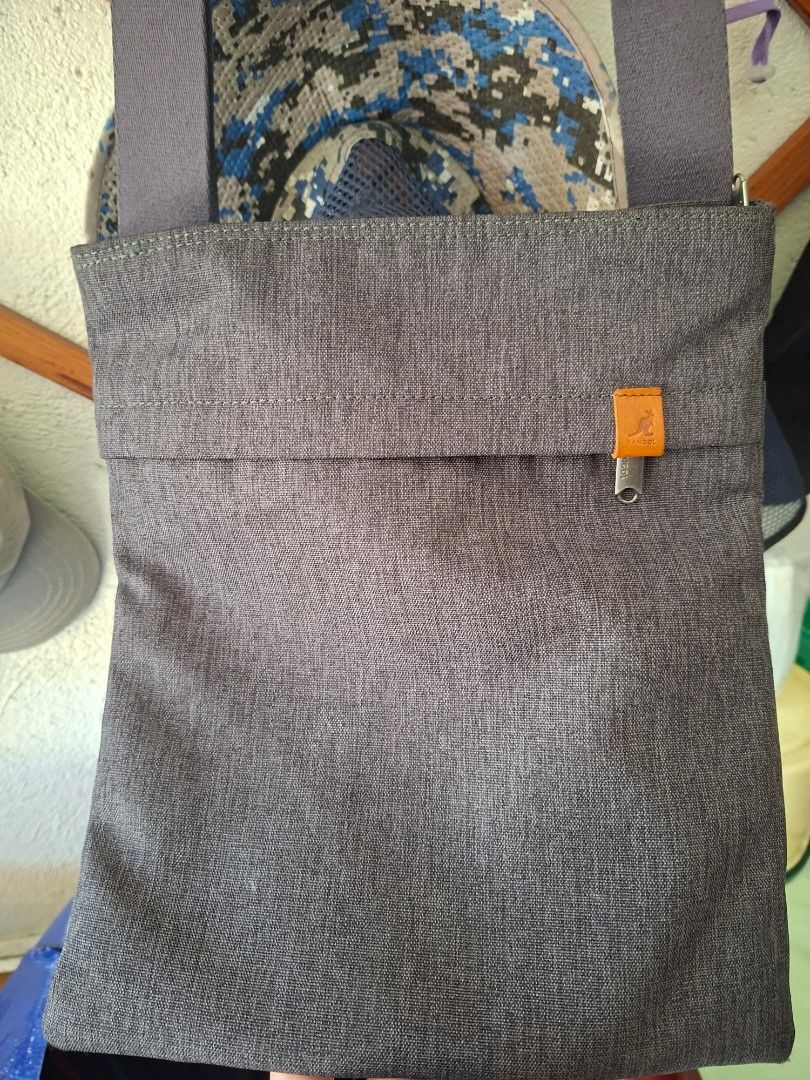Kangol IT Slim Bag Grey Sling Bag (Category: Sling Bags) located in Marikina City. Submitted by Bilimokononatnyan (Listing ID 1462450375, Image 1). Description: - Grey Kangol sling bag - Ideal for everyday use - Main zippered compartment - Inner pocket for organization - Adjustable strap with a stylish leather accent - Unique mesh detail on one inside pocket - Model number: KFB-CB30151 - plus sf.