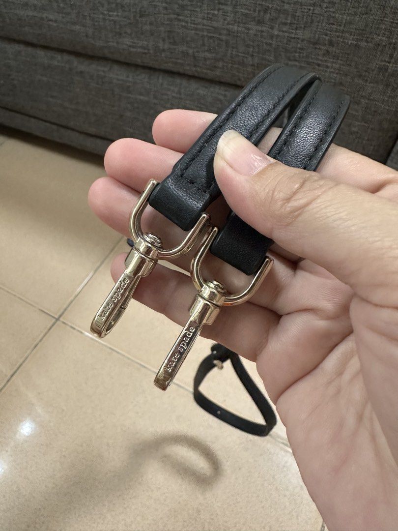Kate Spade Black Leather Bag Strap with Gold Hardware (Category: Luxury Bags & Wallets) located in Caloocan City. Submitted by 4mscloset (Listing ID 1462605989, Image 1). Description: - Genuine Kate Spade black leather strap - Elegant gold hardware with engraved Kate Spade logo - Adjustable length with buckle for versatile wear - Perfect for shoulder or crossbody style - Clean and in good, pre-loved condition - Ready to give your Kate Spade bag a