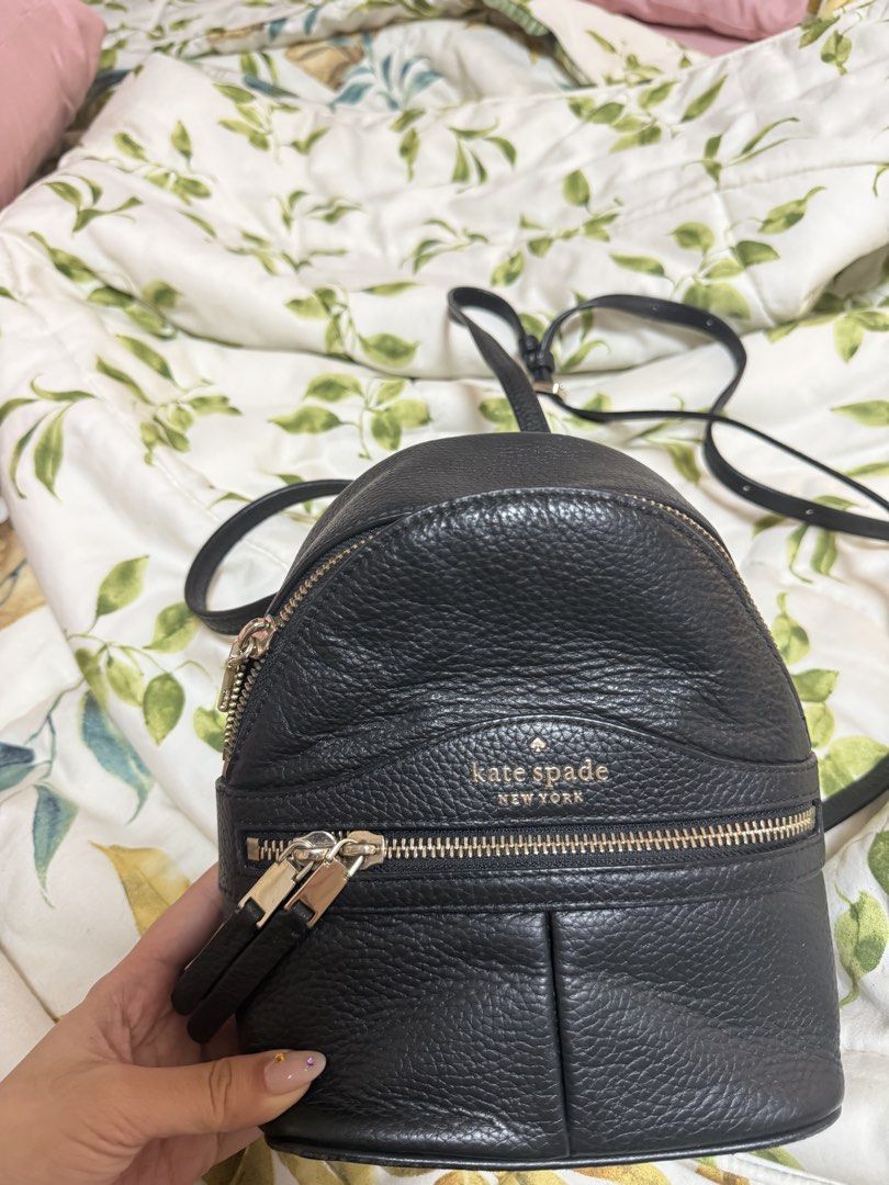 Kate Spade New York Black Leather Mini Backpack (Category: Backpacks) located in Daraga. Submitted by kyotonara1010 (Listing ID 1462605789, Image 1). Description: - Brand: Kate Spade New York - Color: Black - Condition: Good condition, slightly used - Material: Pebbled Leather - Hardware: Gold-tone - Closure: Zip-around - Interior: Small slip pocket - Straps: Adjustable shoulder straps - Ideal for: Everyday use, travel.