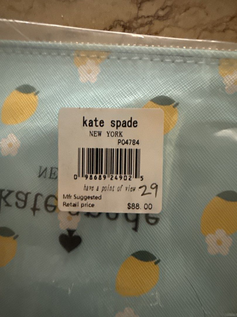 Kate Spade New York Lemon Print Pouch (Category: Community) located in Angeles City. Submitted by migs_font29 (Listing ID 1462512457, Image 3). Description: - Adorable Kate Spade pouch with a vibrant lemon print. - Features a light blue background adorned with yellow lemons and delicate white flowers. - Secure zipper closure for your essentials. - Convenient wrist strap for easy carrying. - Includes original packaging. - Original retail price was