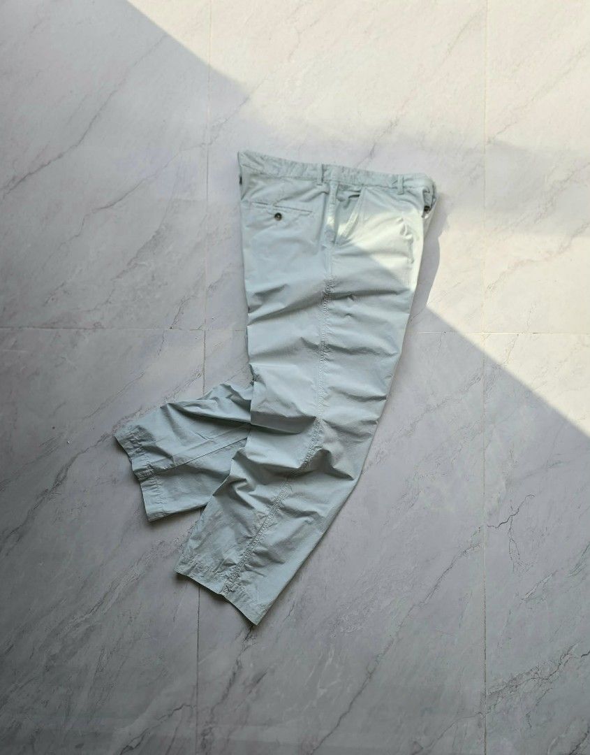 KENZO Light Blue Cotton Blend Trousers (Category: Luxury Apparel) located in Manila. Submitted by annemanzano120906 (Listing ID 1462551567, Image 1). Description: - Light blue KENZO trousers - Comfortable cotton blend fabric - Features iconic KENZO 'K' logo embroidery - Classic button fly closure with unique tortoiseshell button - Relaxed fit with a trendy cropped leg - Ideal for effortless casual outfits.