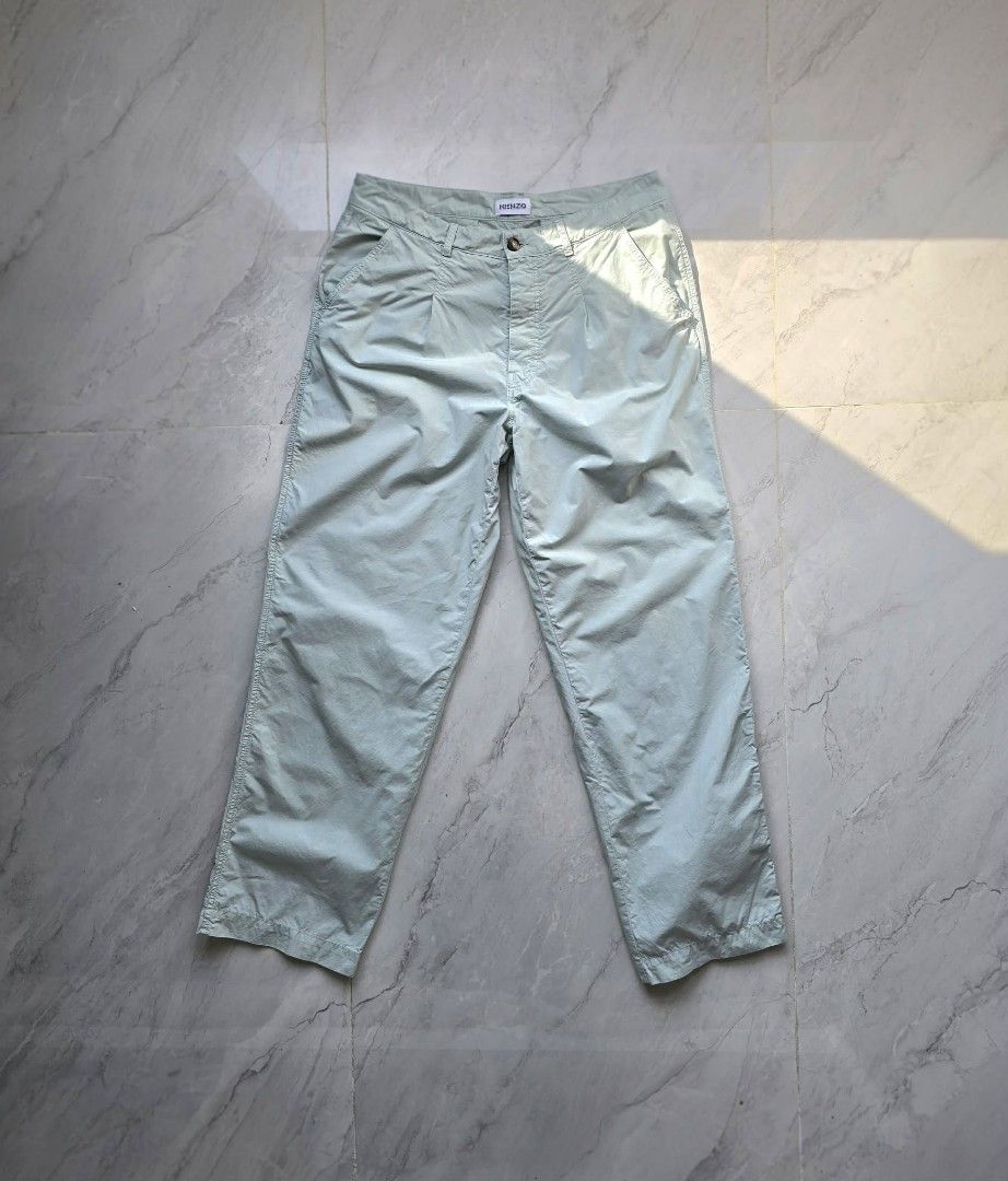 KENZO Light Blue Cotton Blend Trousers (Category: Luxury Apparel) located in Manila. Submitted by annemanzano120906 (Listing ID 1462551567, Image 2). Description: - Light blue KENZO trousers - Comfortable cotton blend fabric - Features iconic KENZO 'K' logo embroidery - Classic button fly closure with unique tortoiseshell button - Relaxed fit with a trendy cropped leg - Ideal for effortless casual outfits.