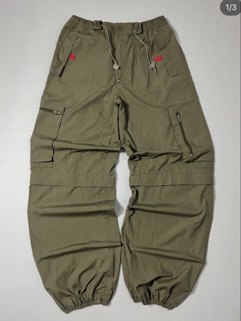 Khaki Cargo Pants with Drawstring Waist and Multiple Pockets (Category: Other Bottoms) located in Davao. Submitted by alfredhobe_10 (Listing ID 1462535915, Image 1). Description: - Khaki cargo pants - Elastic waistband with drawstring for comfort - Multiple pockets, some with zippers for secure storage - Baggy fit for a relaxed and comfortable feel - Ideal for casual wear or streetwear style - Drawstring at the bottom hems - Stylish red accent de