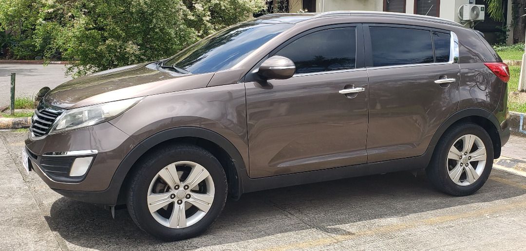 Kia Sportage 2.0 Diesel (A) (Category: Used Cars) located in Antipolo. Submitted by carl426 (Listing ID 1462639148, Image 3). Description: 2012 Kia Sportage EX (Late 2012 manufacturing) CRDi D4HA Turbo Intercooler Diesel 4x2 Automatic Transmission 160,000 KM Features: • Exterior: Sand Track • Interior: Black and Gray • Nano Ceramic Tint • Android Head Unit (Youtube, Netflix, etc.) • Backup Camera and Sensor • Power Windows and Locks • Power Steer