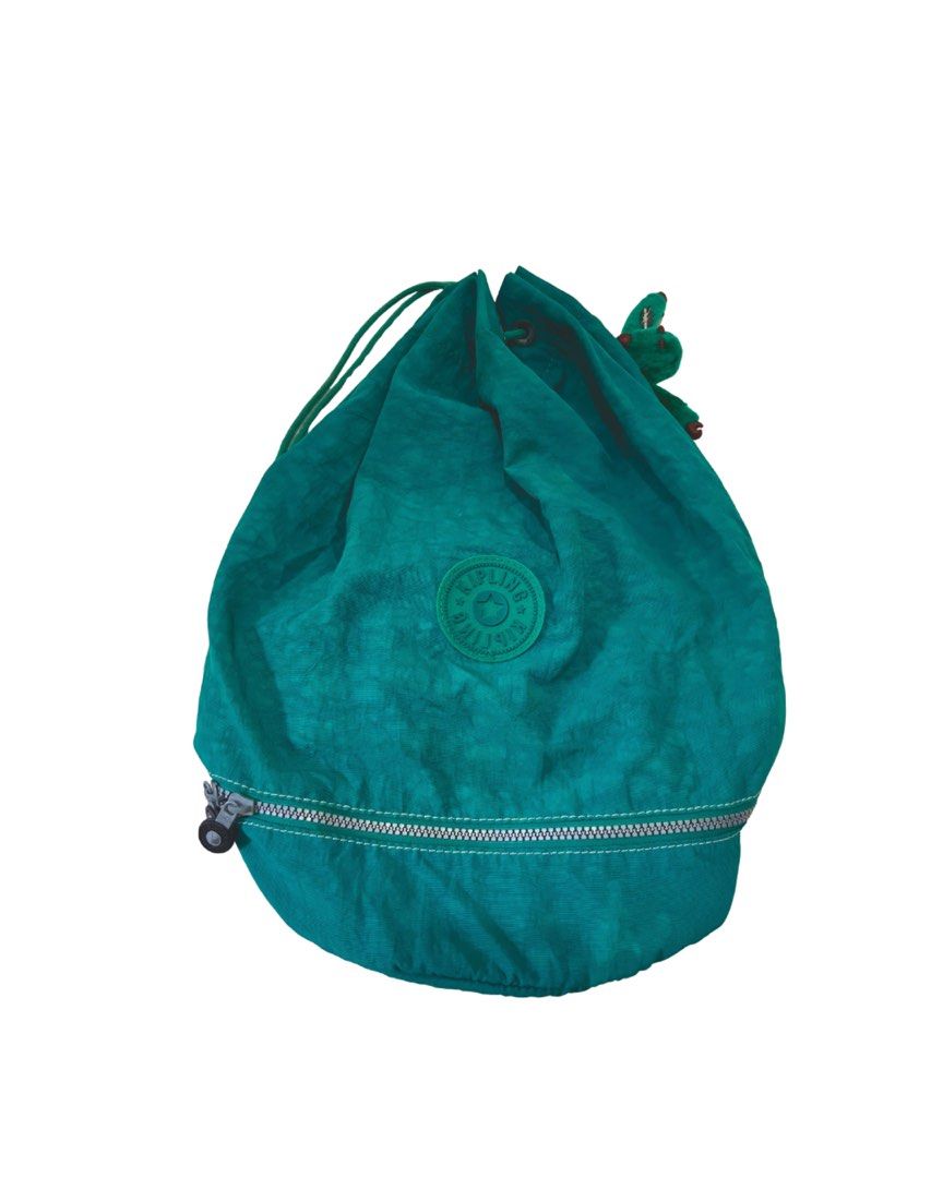 KIPLING 2 Way Bag (Category: Shoulder Bags) located in Marikina City. Submitted by dowsie.shop4divas (Listing ID 1462553714, Image 1). Description: - Brand: Kipling - Type: 2-way bag - Color: Teal - Features: Drawstring closure, signature monkey charm, durable material - Versatile: Can be worn as a shoulder bag or drawstring backpack.