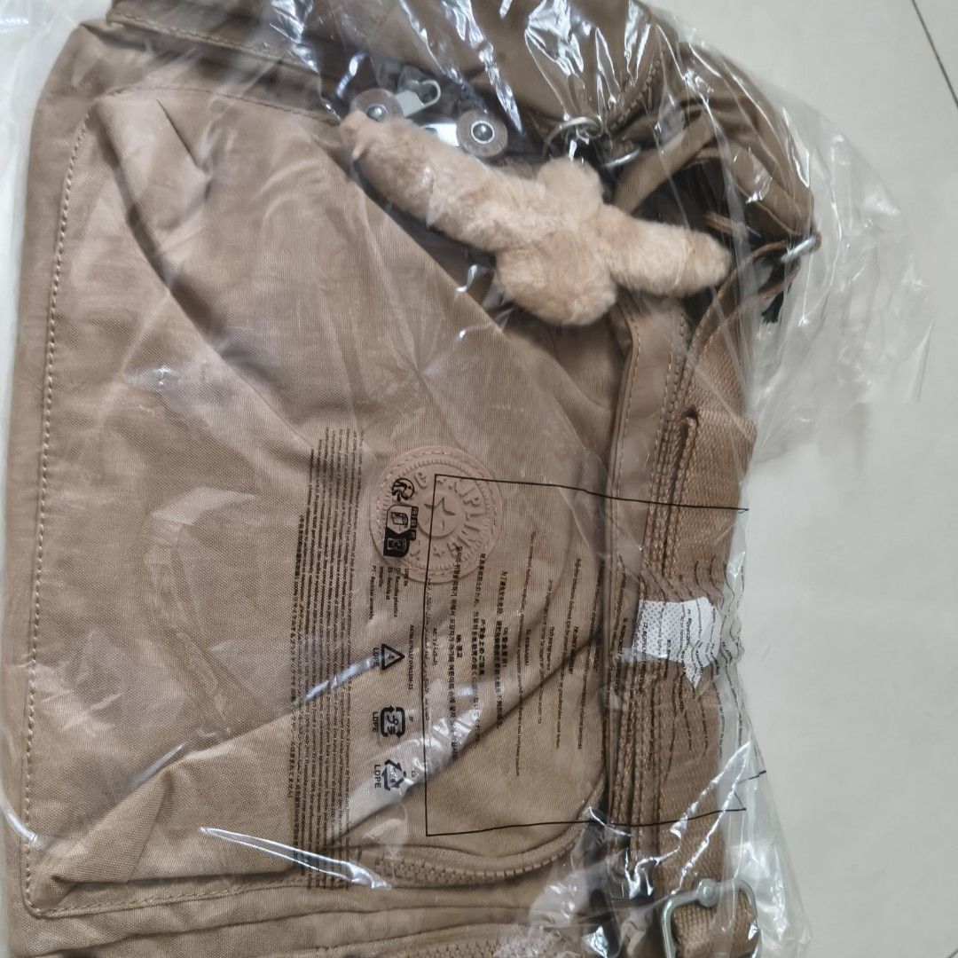 Kipling Basic (Category: Backpacks) located in Singapore. Submitted by mompoh (Listing ID 1462446973, Image 3). Description: - Kipling Basic Gabb Backpack - Colour: Early Tan - Style Code: KPK157407CN1 - Brand New, still in original packaging - Ideal for everyday use.