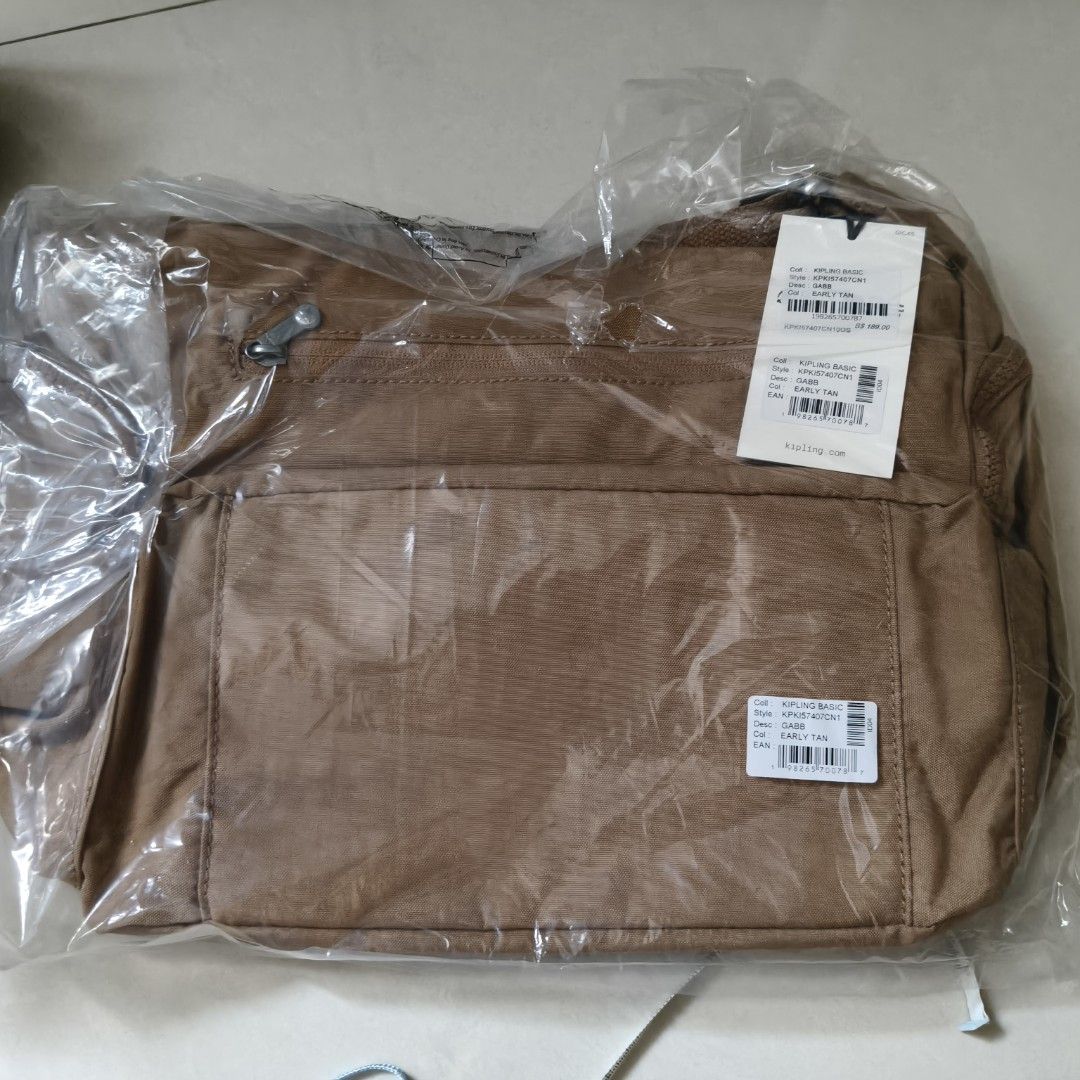 Kipling Basic (Category: Backpacks) located in Singapore. Submitted by mompoh (Listing ID 1462446973, Image 2). Description: - Kipling Basic Gabb Backpack - Colour: Early Tan - Style Code: KPK157407CN1 - Brand New, still in original packaging - Ideal for everyday use.