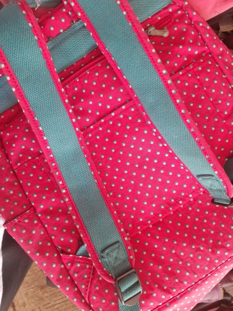 Kipling Pink Polka Dot Backpack with Monkey Charm (Category: Backpacks) located in Calasiao. Submitted by pj_ulanday051184 (Listing ID 1462514158, Image 2). Description: - Adorable pink Kipling backpack - Fun polka dot pattern - Teal straps and trim - Includes signature Kipling monkey charm - Multiple pockets for excellent organization - Perfect for school or everyday adventures - Zippers are in smooth working condition.