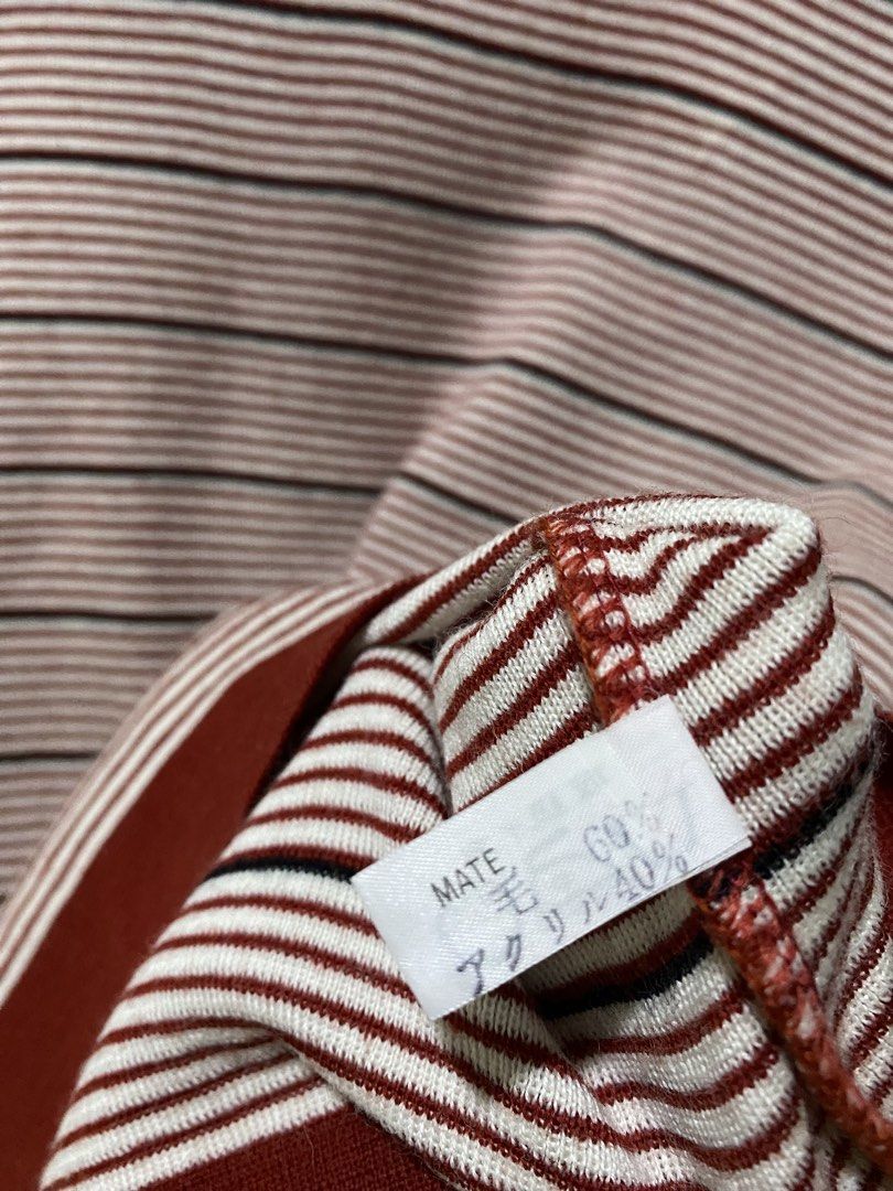 Knit long sleeve white and red stripes (Category: Longsleeves) located in Makati City. Submitted by indaysukaycloset (Listing ID 1462519389, Image 2). Description: ❤️🤍 Knit Long Sleeve - Red & White Stripe Size: Free / Medium to large ✅ Details: - Material: Wool 60% / Acrylic 40% (MATE tag) - Knit fabric, soft and warm, not makati - Color: Off-white x Maroon/Burgundy with black thin stripe - With burgundy ribbing on neck, hem, and cuffs - Good c