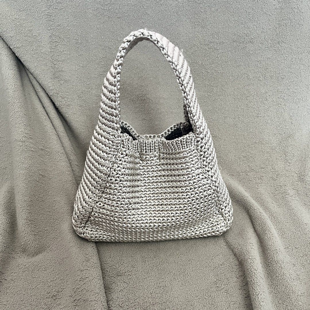 Knitted Mettalic Light Grey Chic Small Shoulder Hand Bag (Category: Tote Bags) located in Naga. Submitted by kitty_cate02 (Listing ID 1462469432, Image 1). Description: Used once In excellent condition - Cute knitted tote bag - Neutral color, matches any outfit - Magnetic snap closure inside - Perfect size for your essentials - Measures approximately 7 inches tall - Super elegant and spacious.