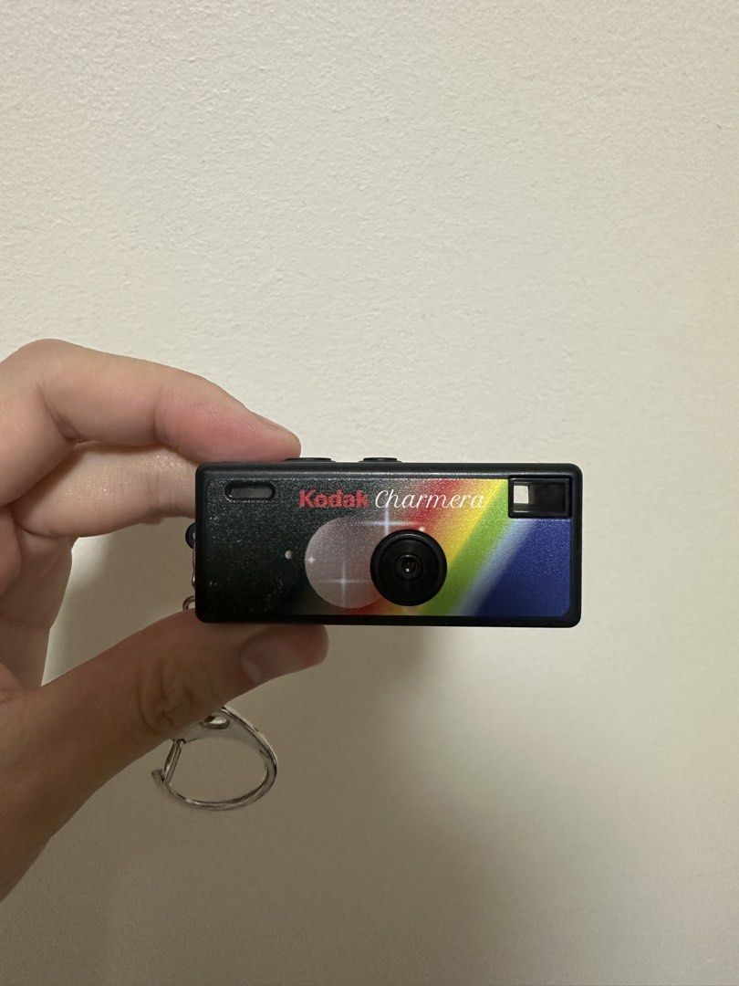 Kodak Charmera Digital Camera Keychain (Category: Cameras) located in Pasay City. Submitted by kimricasa (Listing ID 1462587678, Image 1). Description: - Adorable Kodak Charmera keychain camera - Features a vibrant rainbow design on the front - Compact digital camera with a rear screen and buttons - Includes a keychain ring for easy portability - Ideal for capturing fun, spontaneous photos - Makes a unique and quirky accessory.