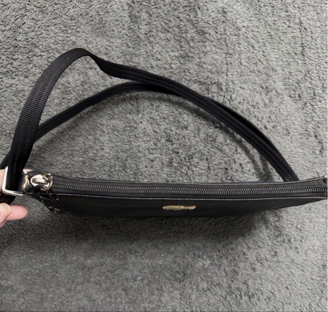 Lacoste Black Crossbody Bag (Category: Cross-body Bags) located in Pasay City. Submitted by szepter (Listing ID 1462445381, Image 3). Description: - Authentic Black Lacoste Crossbody Bag - Secure Zipper Closure - Adjustable Strap for Comfort - Interior features 'LACOSTE' Branding - Includes Small Tag - Ideal for Everyday Use.
