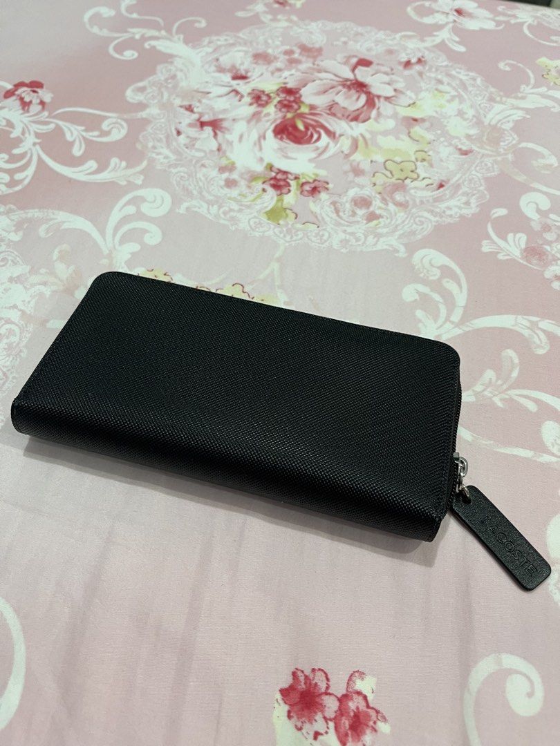 Lacoste Black Zip Around Wallet (Category: Wallets & Card holders) located in Manila. Submitted by willyvertis07 (Listing ID 1462465617, Image 2). Description: - Authentic Lacoste black zip-around wallet. - Ample card slots for organization. - Secure zipper closure to keep essentials safe. - Iconic Lacoste crocodile logo on the exterior. - Interior lining features Lacoste branding. - A timeless and functional accessory..