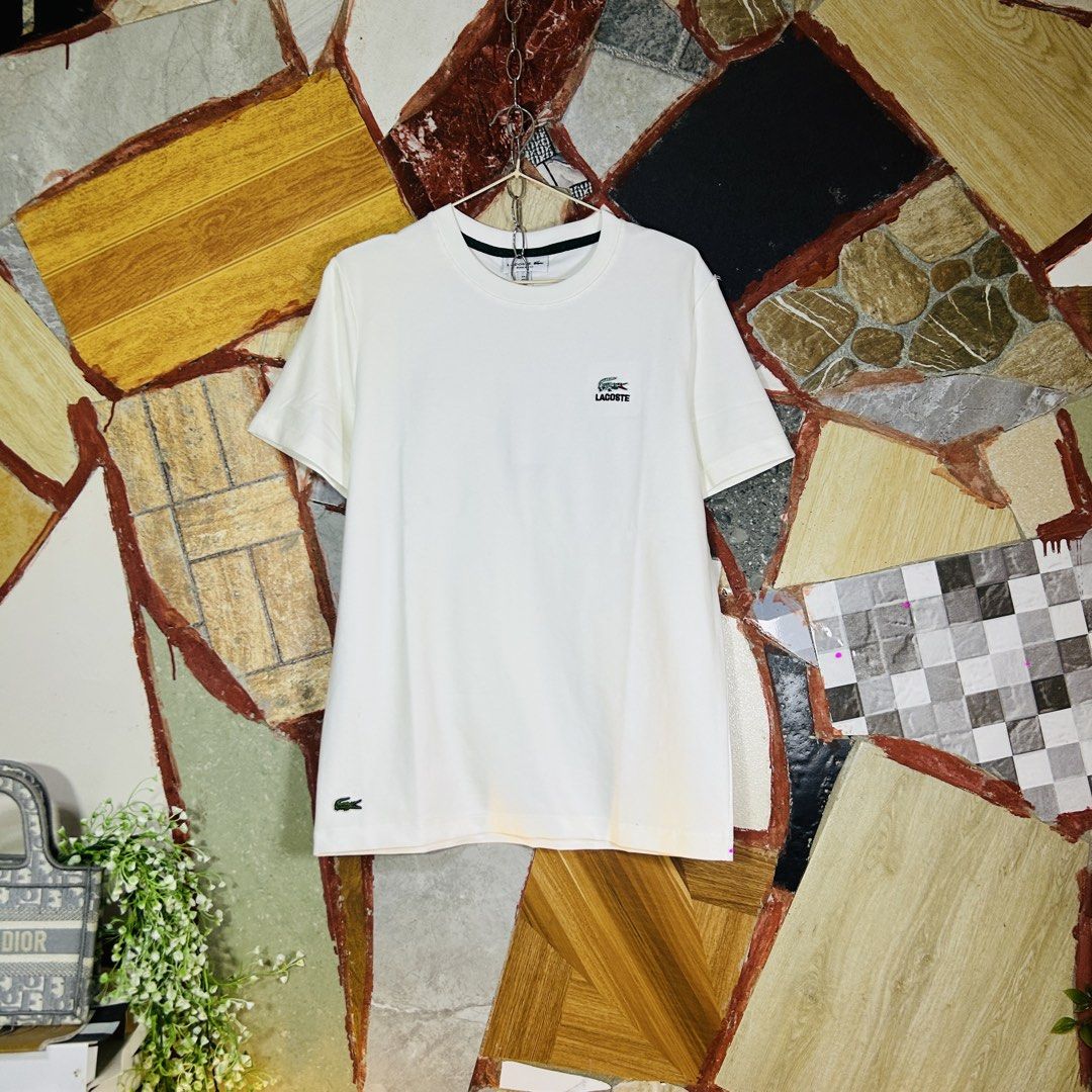 Lacoste cotton shirt (Category: Luxury Apparel) located in Baguio. Submitted by kckc_luxury (Listing ID 1462626601, Image 1). Description: 🌸 TINY PINK SPOTS ARE LENS DAMAGE, NOT CLOTH STAINS ————————— ❗️KINDLY READ BEFORE MAKING AN OFFER❗️ LISTING DETAILS size:M-L width x length (inches):20x28 condition: EXCELLENT --- MOP: Gcash / BPI MOD: J&T / JRS LOCATION: Baguio City --- NOTE: • Manage your expectations • Photos did not go under any edit but